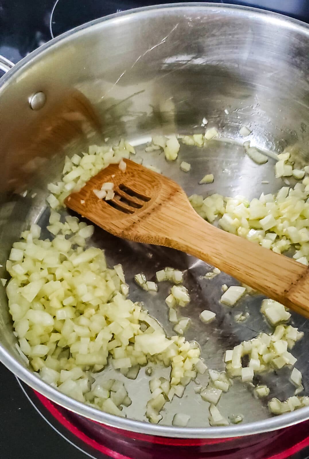 a pan with diced onions and garlic