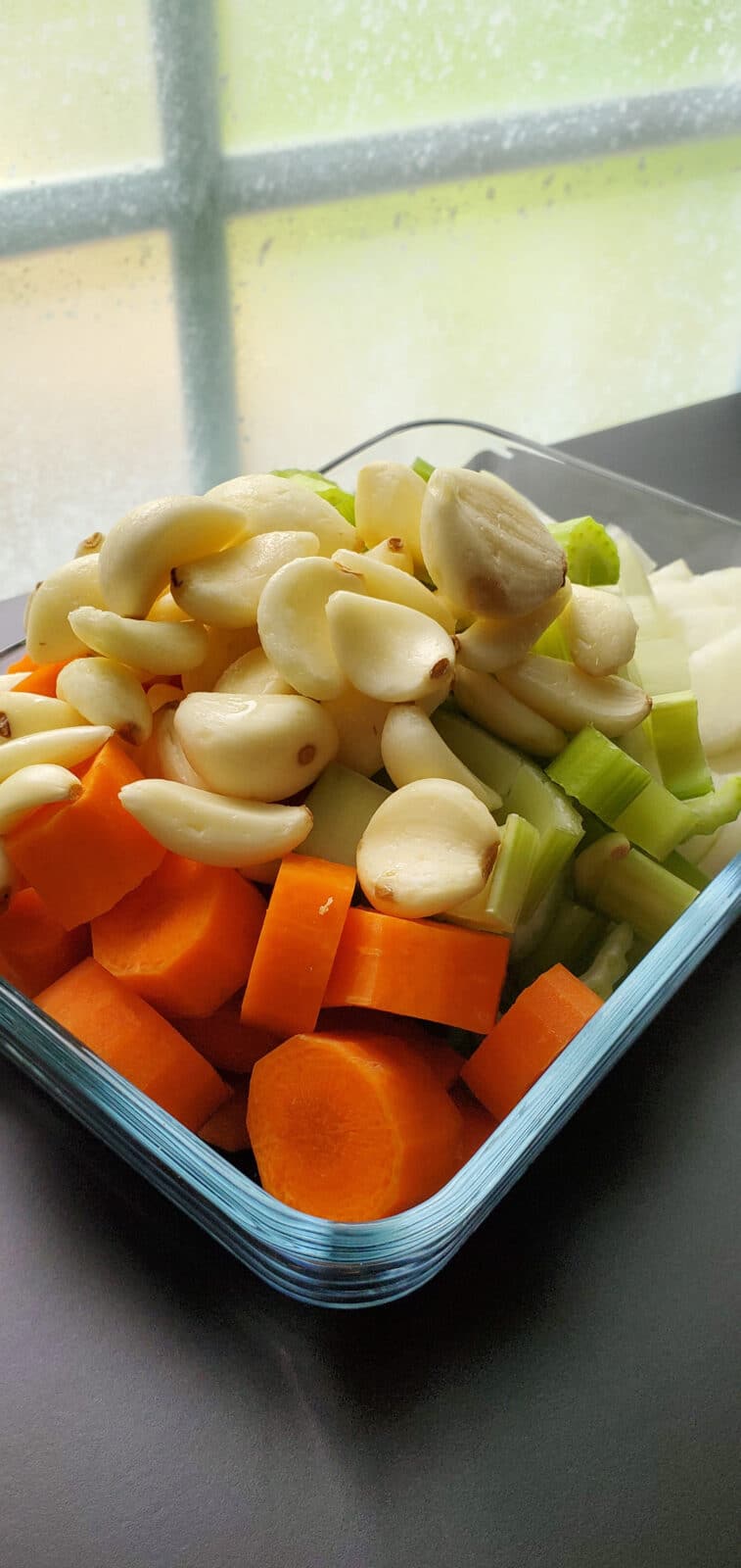 A bowl of mirepoix, a mixture of carrots, onions, celery, and garlic