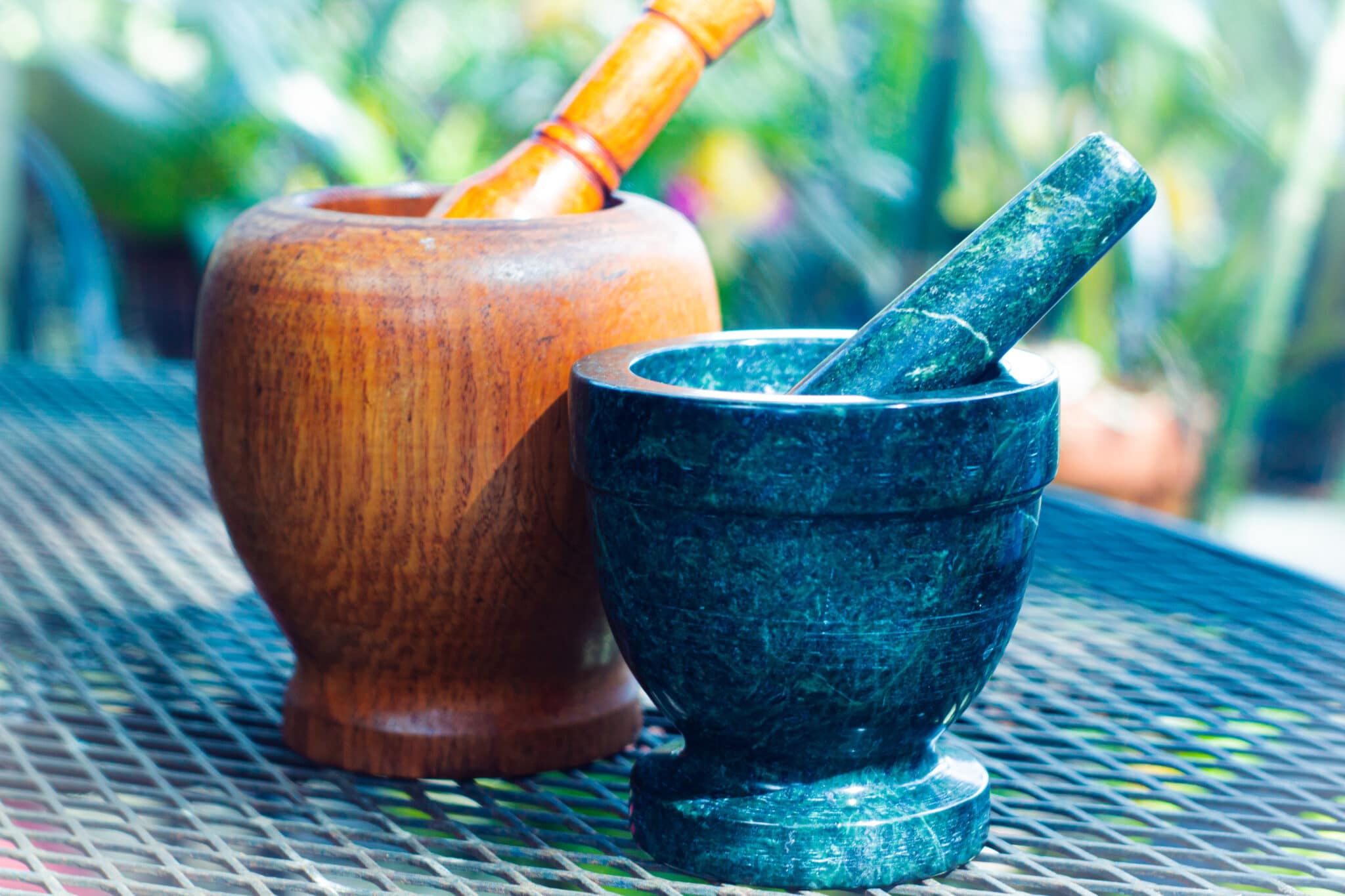 two pestles and mortars on a table